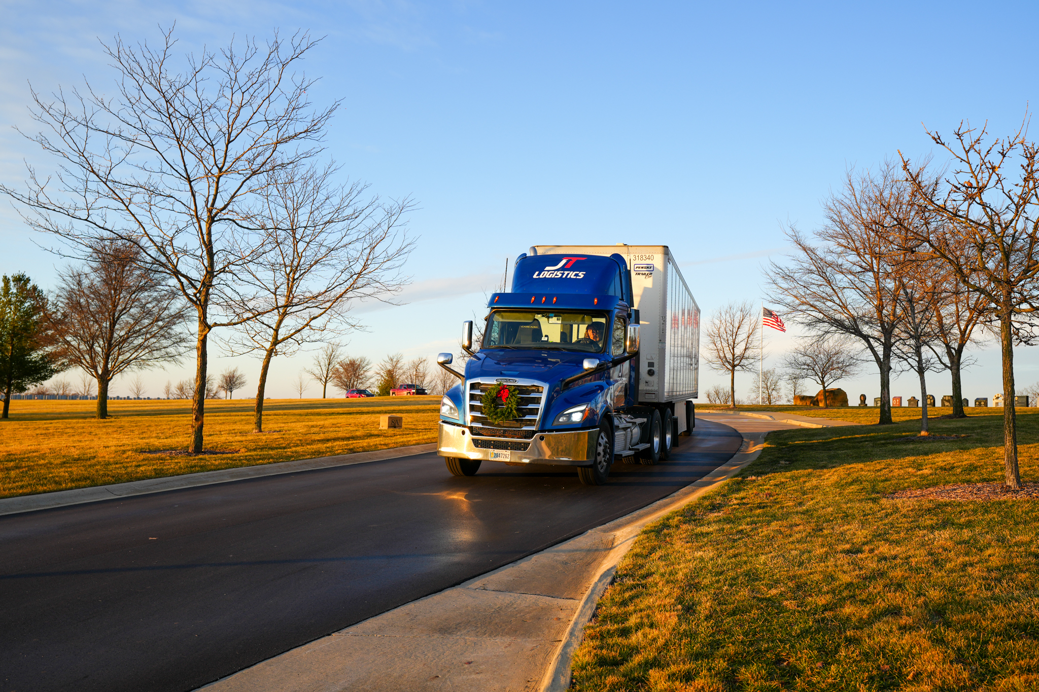 JT Logistics Driver Jane Good prepares to make veteran wreaths delivery to Iowa cemetery.