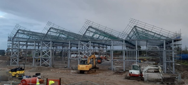 Workshop and stores building cladding underway.