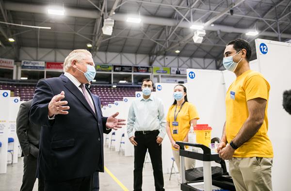 Premier Ford thanks volunteers at the Hockey Hub vaccination centre at the CAA Centre in Brampton.