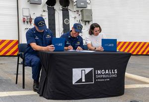 With the signing of the ceremonial documents, national security cutter Calhoun (WMSL 759) is officially transferred from HII to the U.S. Coast Guard.Pictured (left to right): Capt. Peter Morisseau, commanding officer, Project Resident Office Gulf Coast; Cmdr. Timothy Sommella, executive officer, Calhoun (WMSL 759); and Amanda Whitaker, Ingalls Shipbuilding NSC program manager. Photo by HII.