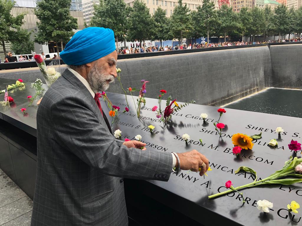 UNITED SIKHS Volunteers Paying Respects and Distributing Flowers at the 9/11 Ground Zero Memorial in Manhattan

