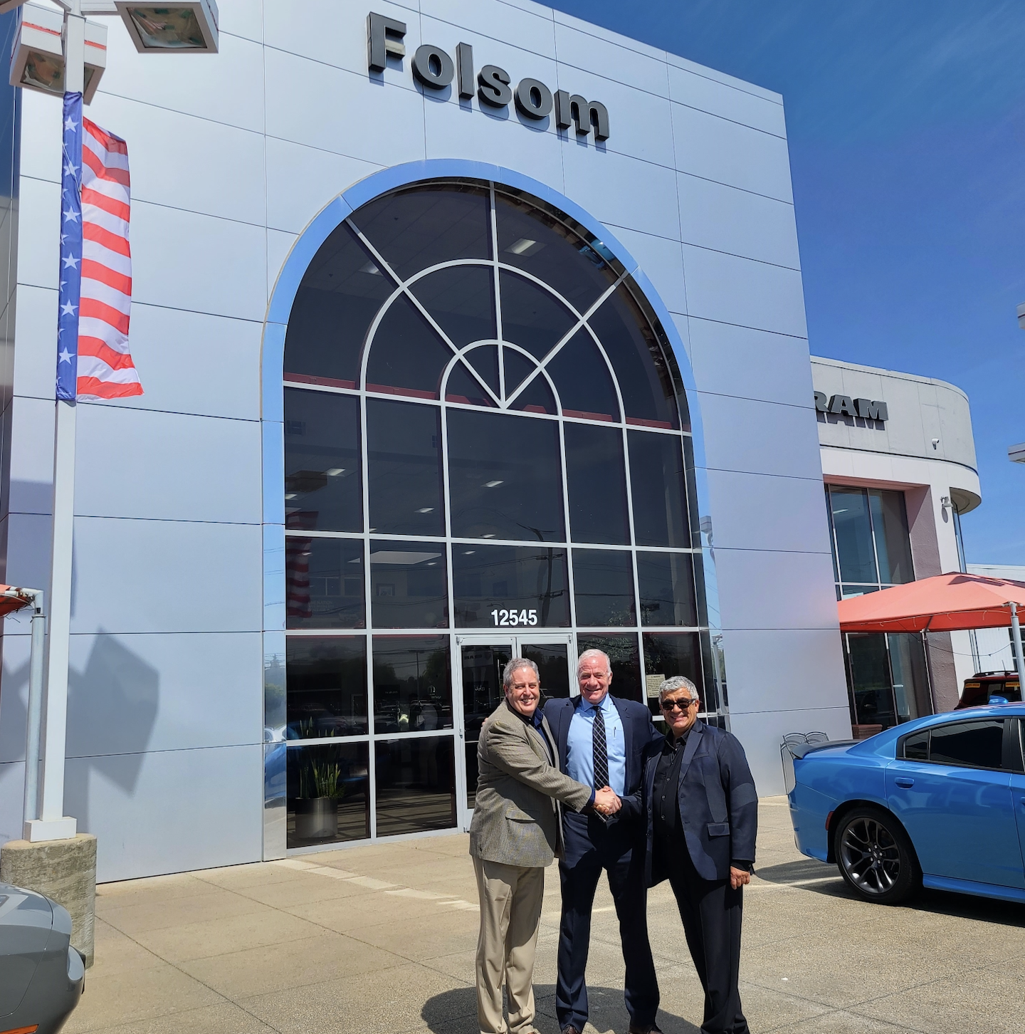 Fifth Wave Automotive closes on Folsom Lake Chrysler Dodge Jeep Ram in Folsom, CA on April 3, 2024. Pictured left to right: Steve Corle, Director of Tim Lamb Group, Vince Bloom, General Manager of Folsom Lake Chrysler Dodge Jeep Ram, and Carlo Hidalgo, President of Fifth Wave Automotive Group. Photo Credit Tim Lamb Group