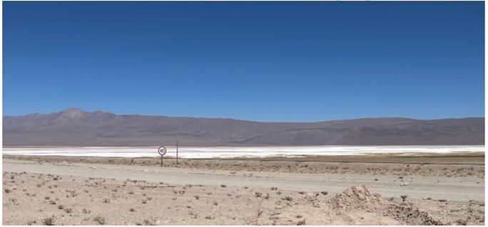 Pocitos Salar with power lines and rail to Antofagasta, Chile Port