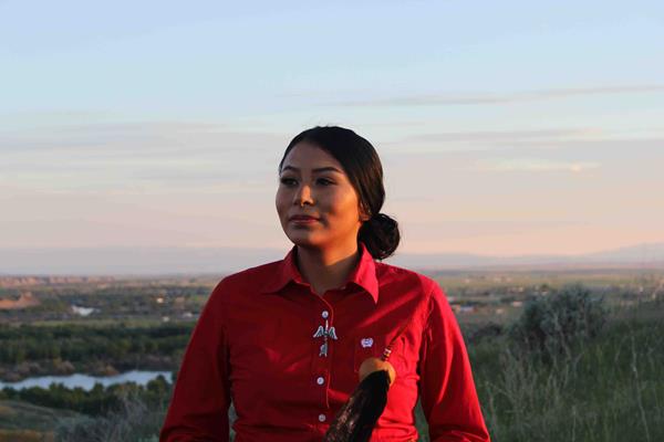 Deshawna Anderson, an American Indian College Fund scholar and business student at Little Big Horn College in Crow Agency, Montana. Anderson designed The Courage to Bloom, which is available for purchase in Pendleton’s American Indian College Fund Blanket Collection.