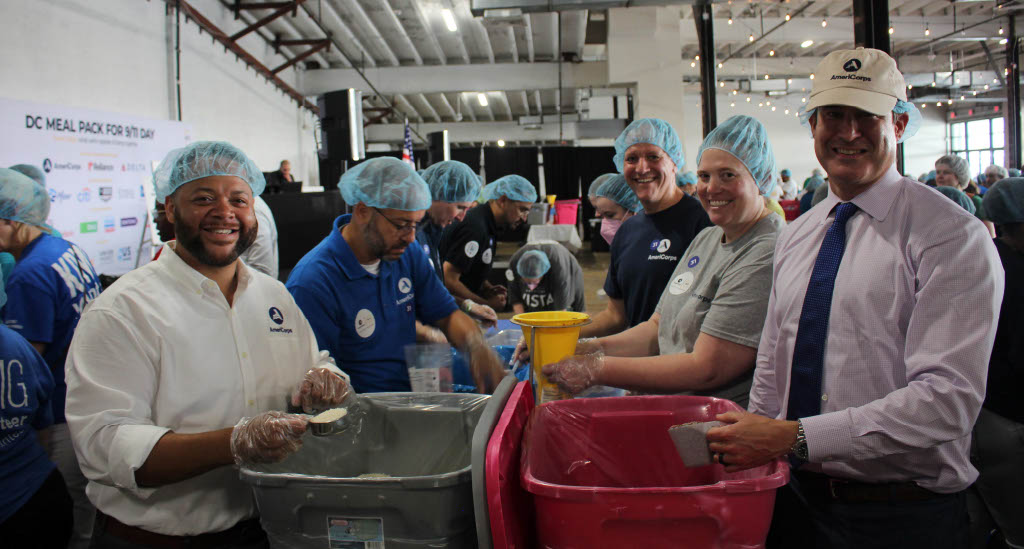 AmeriCorps CEO and Representative Seth Moulton (MA-06) packing meals for 9/11 Day of Service