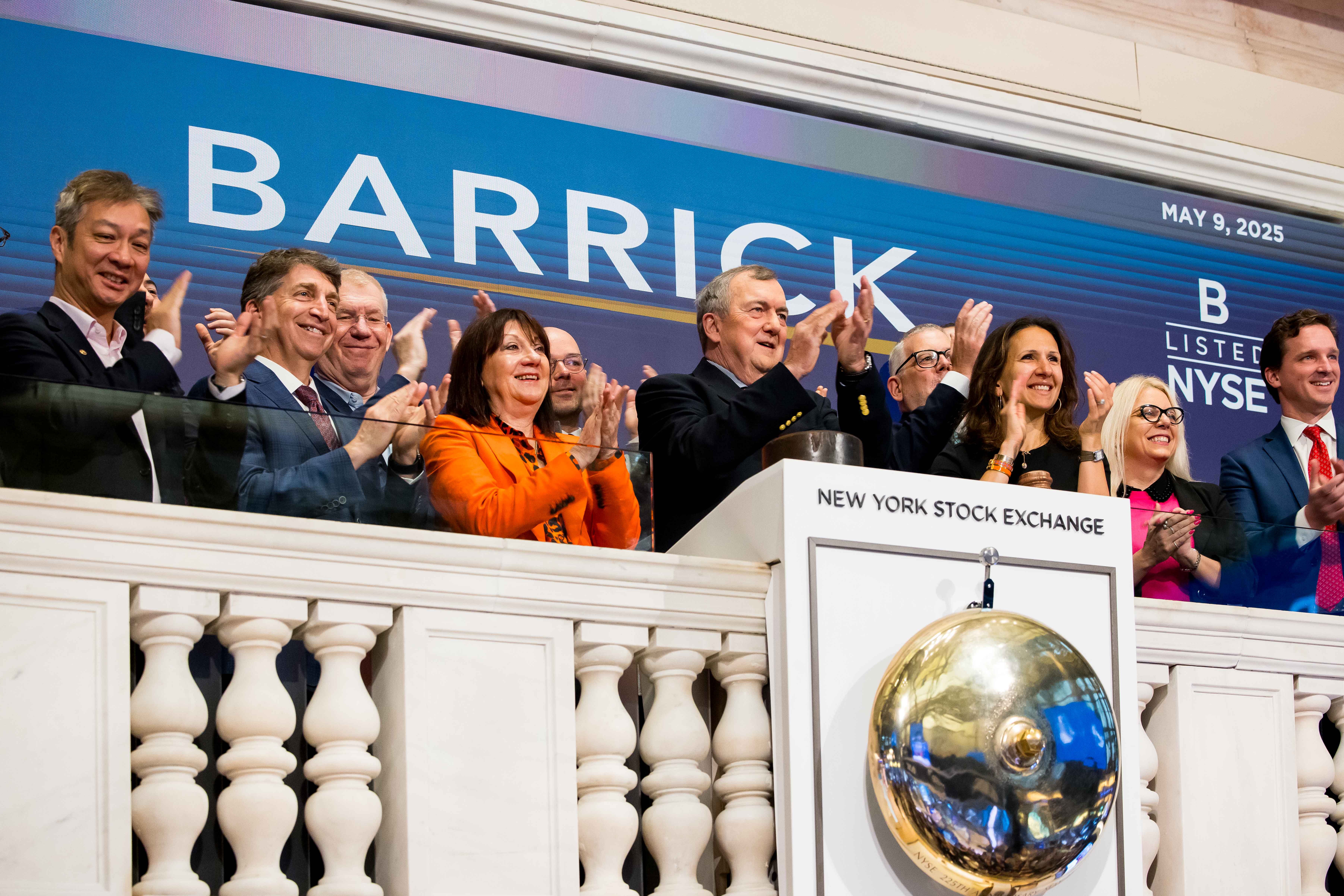 The image shows a group of people at the New York Stock Exchange (NYSE) during what appears to be a bell ringing ceremony for Barrick.