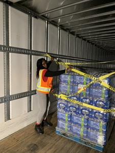 An ADUSA Distribution associate supports Food Lion Feeds’ emergency-relief efforts by loading water onto a semi-trailer for delivery to Second Harvest of South Georgia in Valdosta, GA.