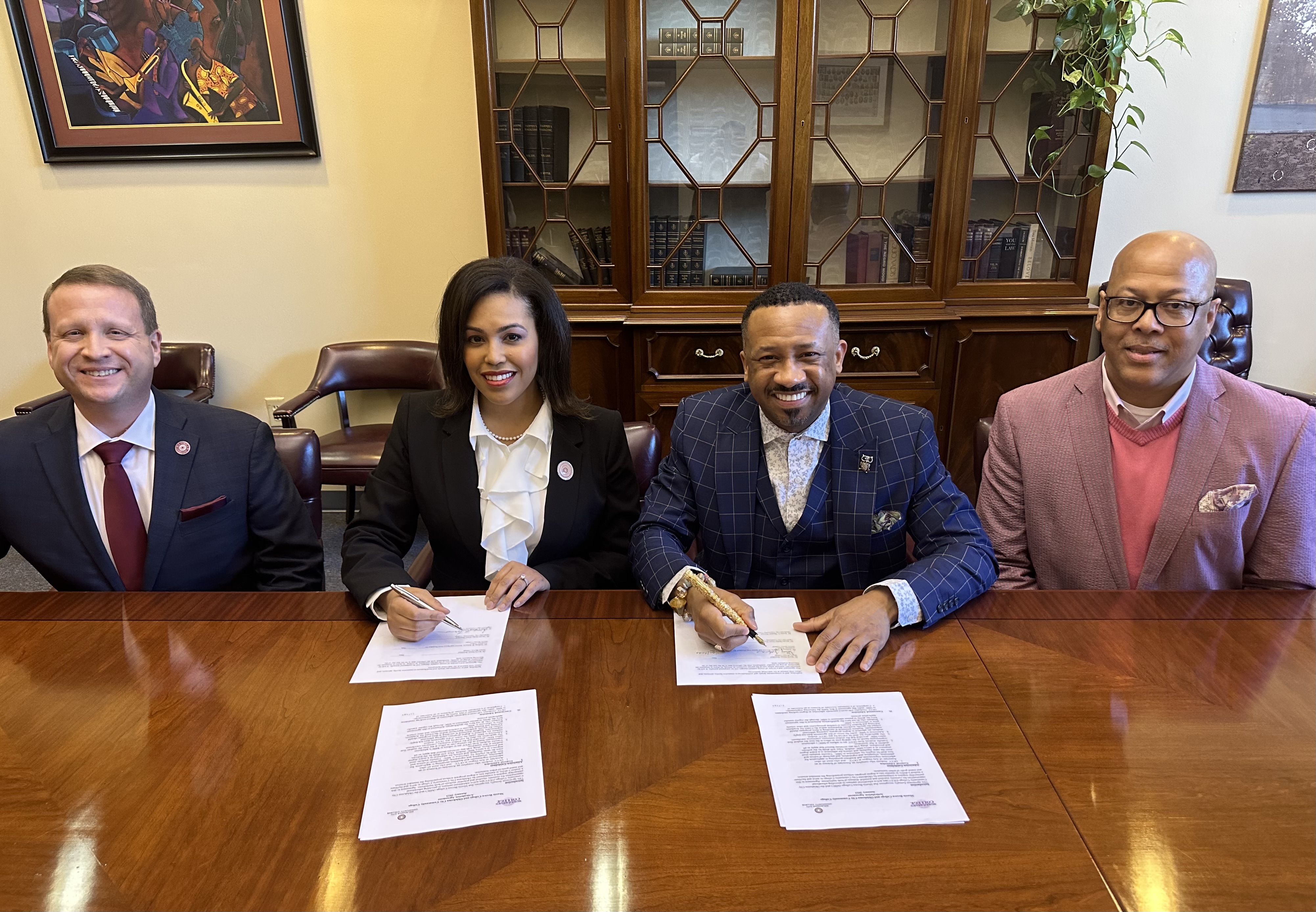 College leadership gathers to formalize agreement