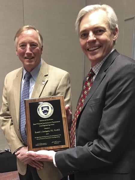 Ron Carrington (right) receives the American Society of Civil Engineers 2017 Gene Wilhoite award for contributions to the advancement of the transmission line industry. 