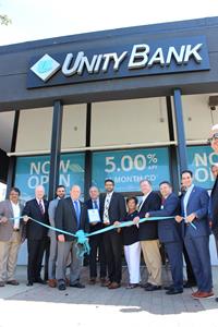 Attending the Unity Bank Parsippany opening (from left) are Jigar Shah of DK International; James Gannon, Morris County Sheriff; Dan Sharabba, Unity Bank Senior Retail Officer; James Barberio, Parsippany-Troy Hills Mayor; Frank Cahill, Parsippany-Troy Hills Economic Development Chairman; Dhaval (DJ) Bhatt, Unity Bank Parsippany Area Manager; Loretta Gragnani, Parsippany-Troy Hills Township Council President; George Boyan, Unity Bank Chief Financial Officer; Robert Peluso, Parsippany Area Chamber of Commerce CEO; and Justin Musella, Parsippany-Troy Hills Township Council Member.