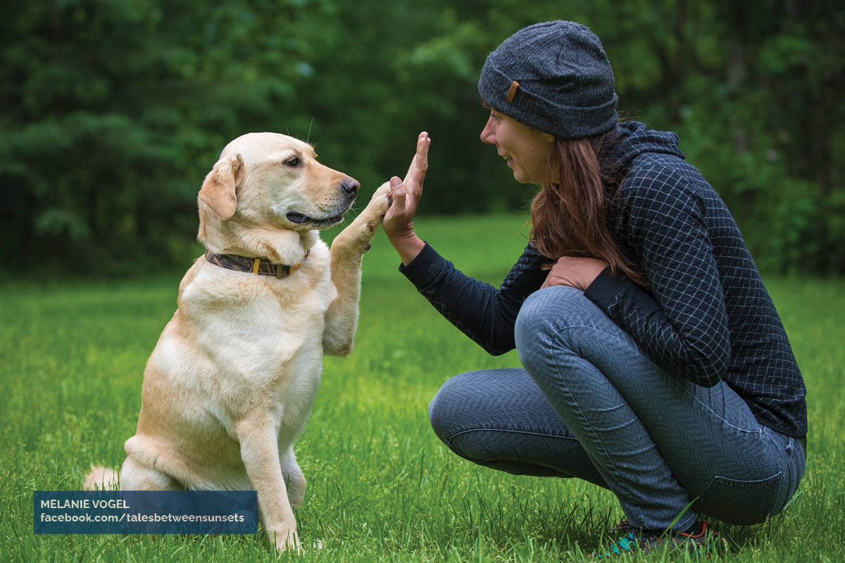 Hiker Melanie Vogel and her adopted dog, Malo