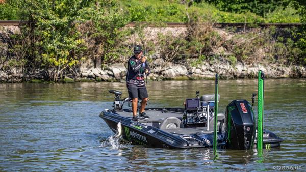 FLW Tour pro Tyler Stewart hoists a largemouth into his boat on Day Two of the FLW Tour on Lake Champlain presented by T-H Marine. (Curtis Niedermier)