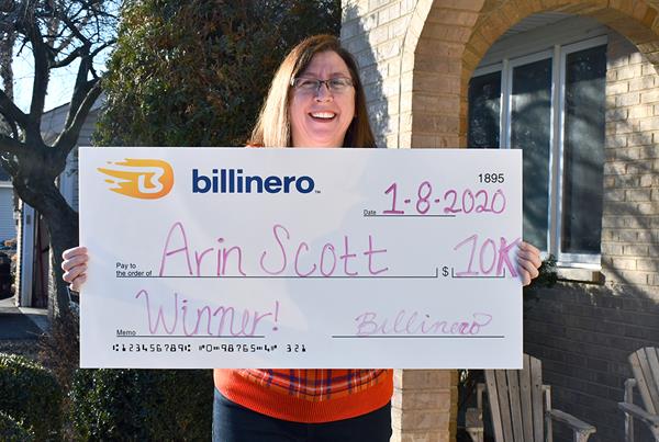 Arin Scott of Mundelein, Ill., proudly holds her $10,000 check after winning Billinero's Quarterly Drawing in January 2020.