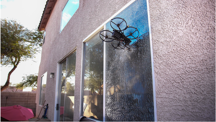 LEMUR drone breaking glass for entry