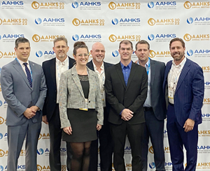 Nick van der Walt, Selene van der Walt, Chad Rains, Jonathan Nielsen and Louie Vogt accepted the AAHKS Industry Innovation Award. They are joined by Dr. Lucian Warth and Dr. Bryan D. Springer, President of AAHKS.