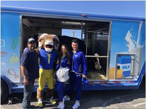 Dairy Council of CA's Mobile Dairy Classroom with representatives from the Los Angeles Rams