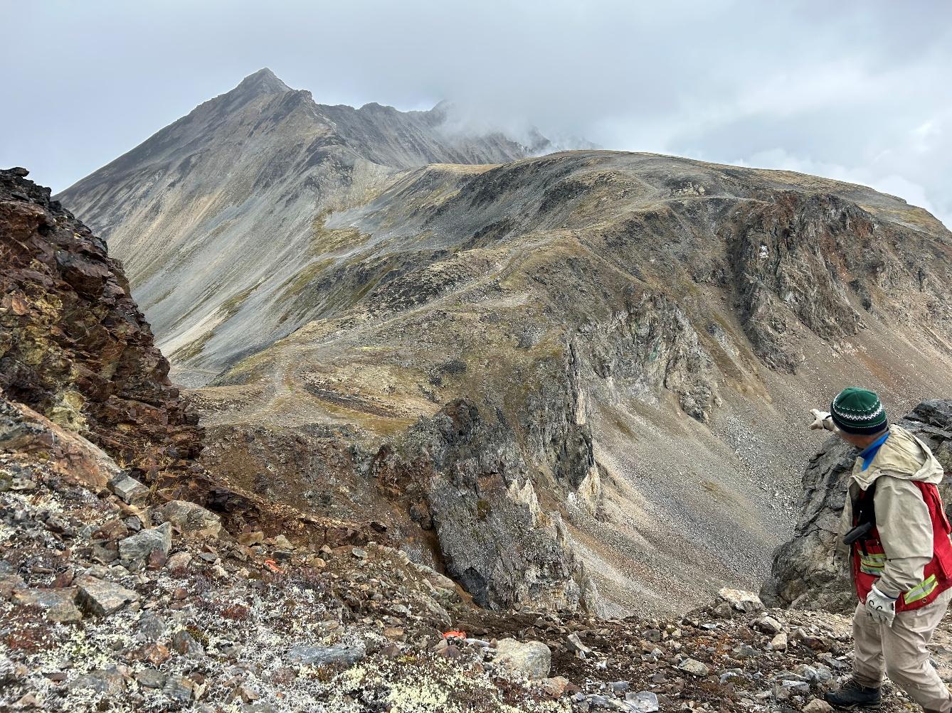 Len Gal points out additional malachite staining and oxidization between Canadian Verdee and Mildred showings. Suggest of a 2.6 km strike.