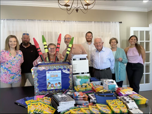 The Jeff Cook Real Estate Myrtle Beach Office gets ready to donate their school supplies.