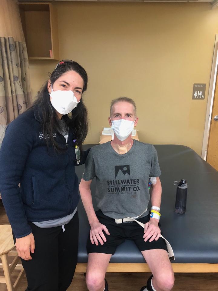 Oklahoma Fire Captain Randy Blake with lung transplant Norton Thoracic Institute pulmonologist, Sofya Tokman, MD, during a therapy session in the Barrow Neuro Rehabilitation unit at Dignity Health St. Joseph's Hospital and Medical Center in Phoenix. Blake survived COVID-19 but suffered irreversible lung damage and needed a lifesaving lung transplant.