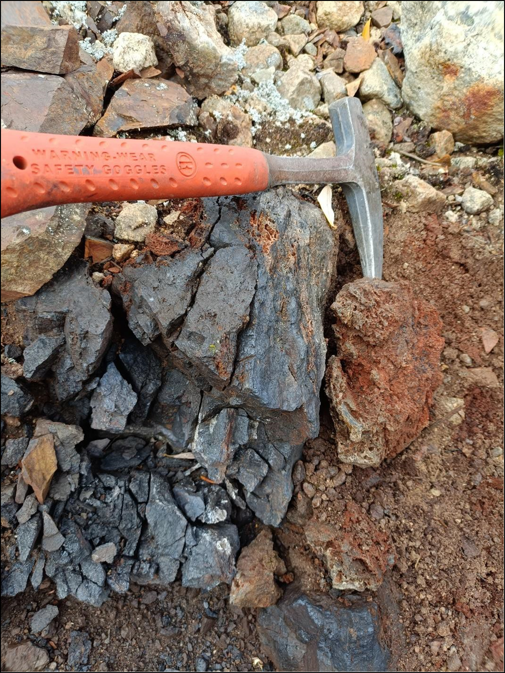 Outcrop of the oxidized massive sulfide manto in contact with the gossan zone