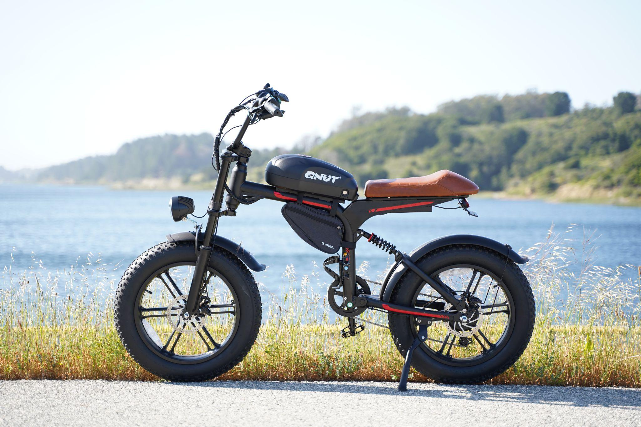 A QNUT Victor Electric Bike parked by the seaside