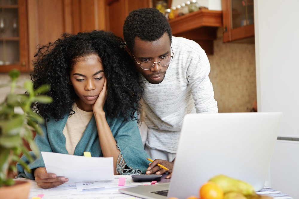 Black American couple works together to manage personal finances