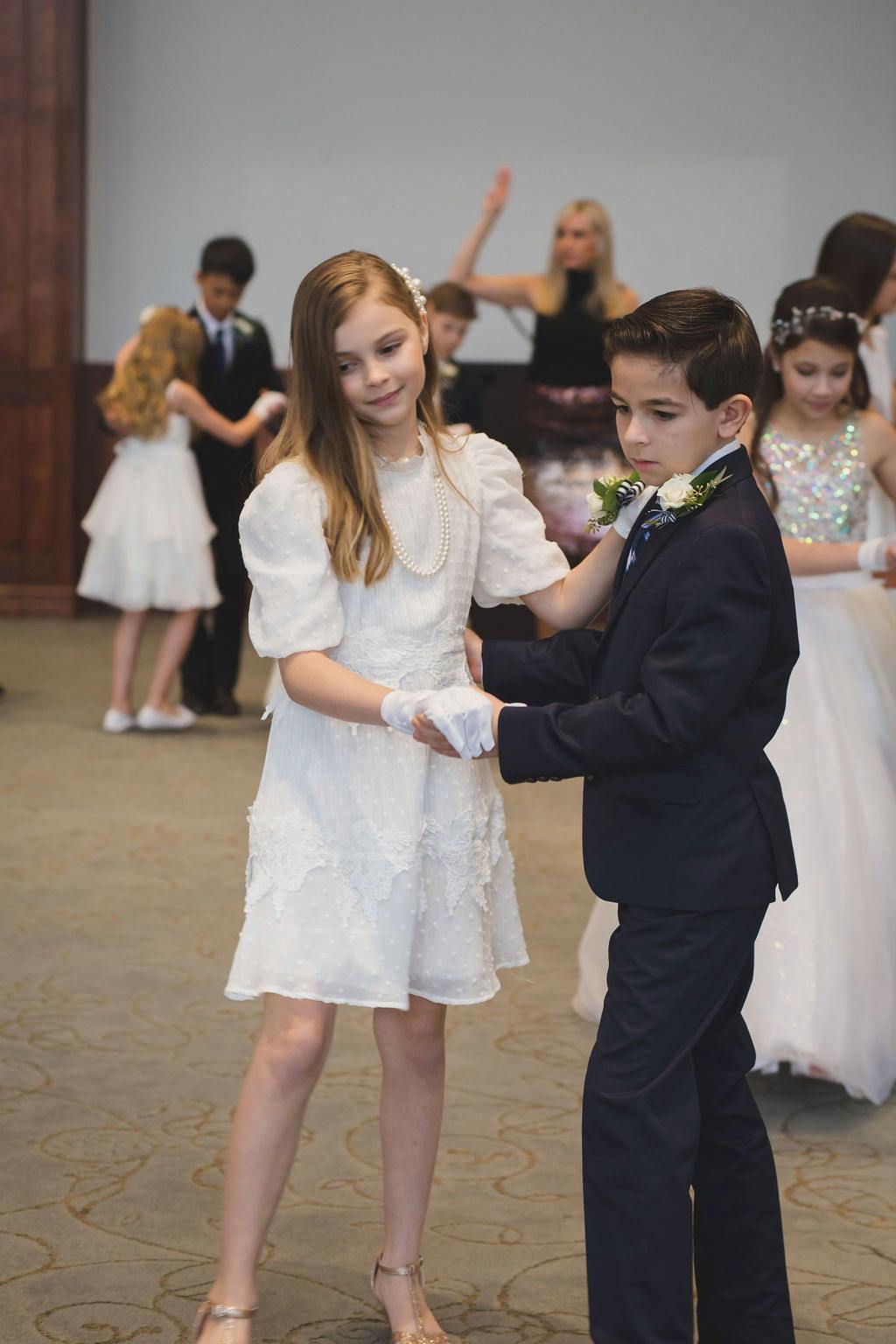 Junior Cotillion students practicing NLJC dance steps at the Grand Spring Ball. 