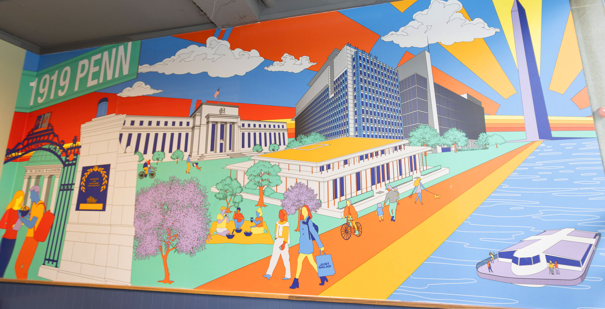 Colorful mural inside Just Salad’s Washington, D.C., location showing local landmarks and the Potomac waterfront.