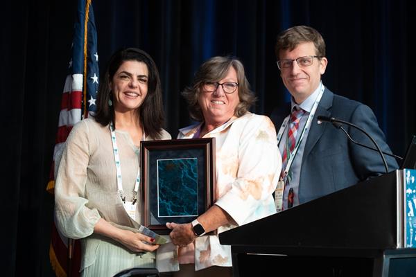 Kelly C. Stéfani, MD, PhD, (left) accepts the 2019 Women’s International Leadership Award from the 2018 Women’s Leadership Award recipient, Ruth L. Thomas, MD, (center) and president of the Orthopaedic Foot & Ankle Foundation, Scott J. Ellis, MD, (right).
