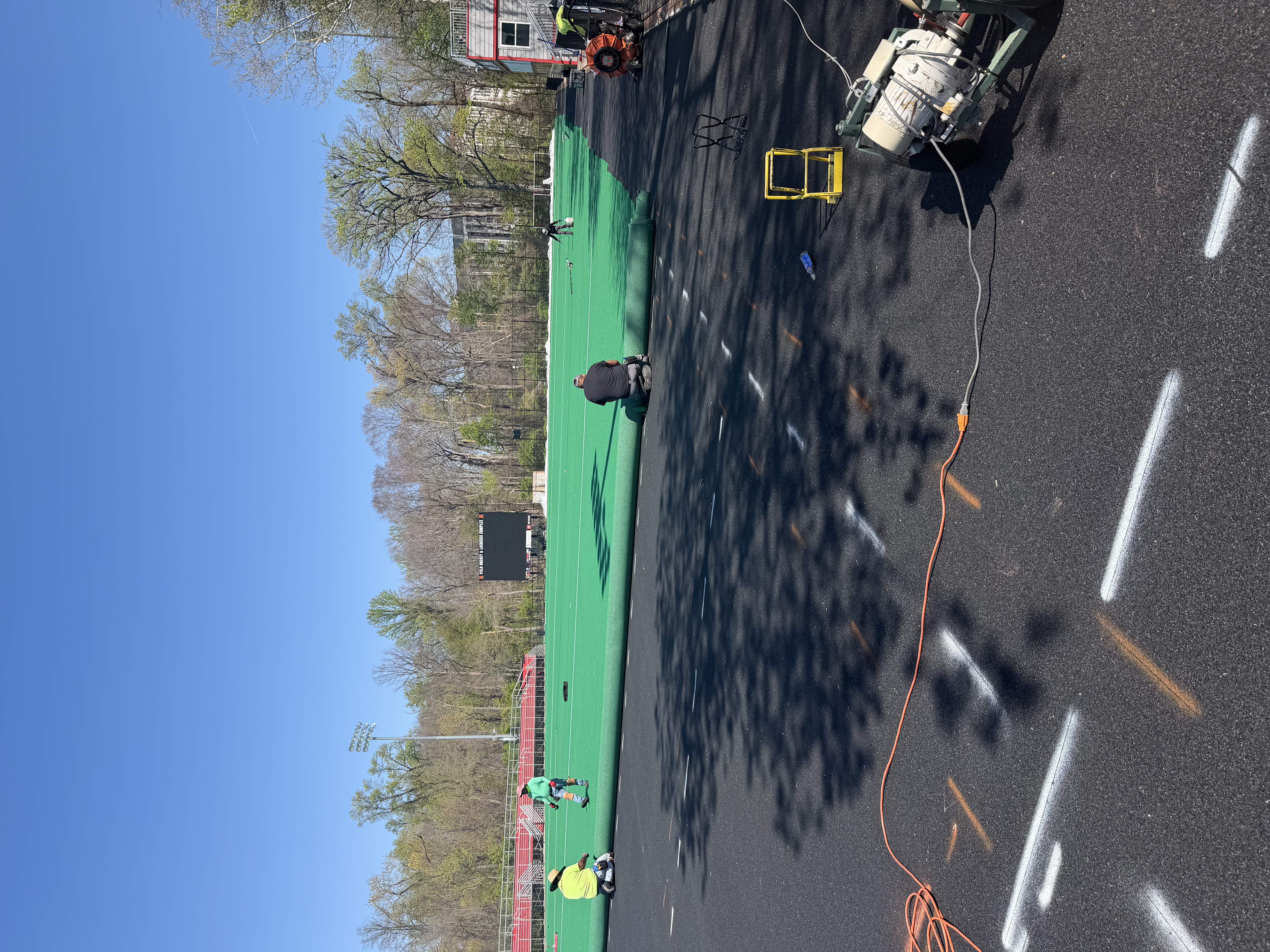 Installers work to Install Updated Astroturf 12 System for University of Maryland Field Hockey (2)