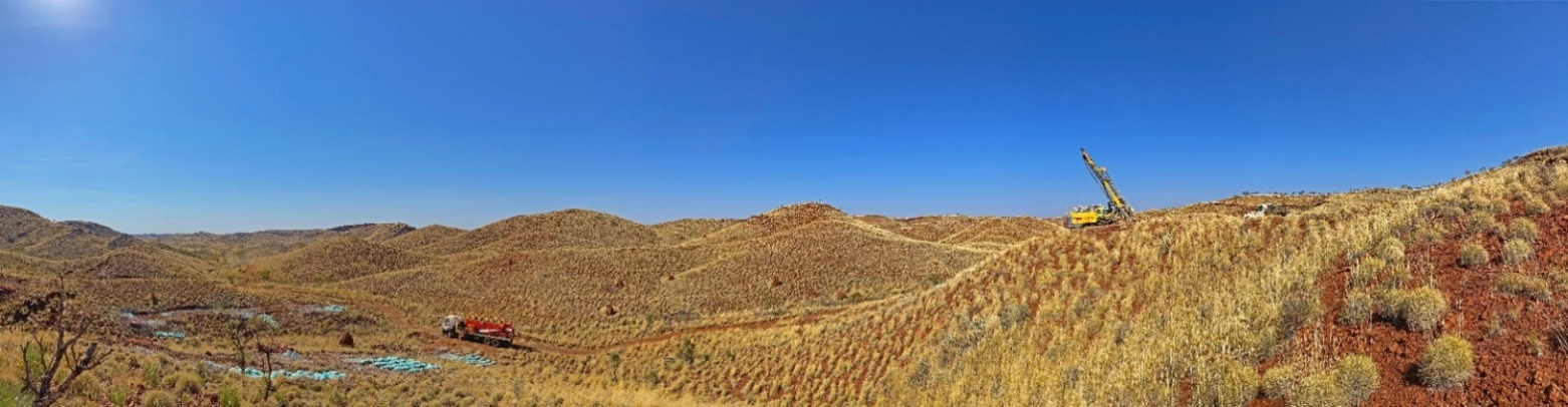 Figure 2: RC drilling at Nunyerry North looking to the southwest. The RC rig is drilling hole NC009, and holes NC001 to NC006 are shown in the left side of the photo.