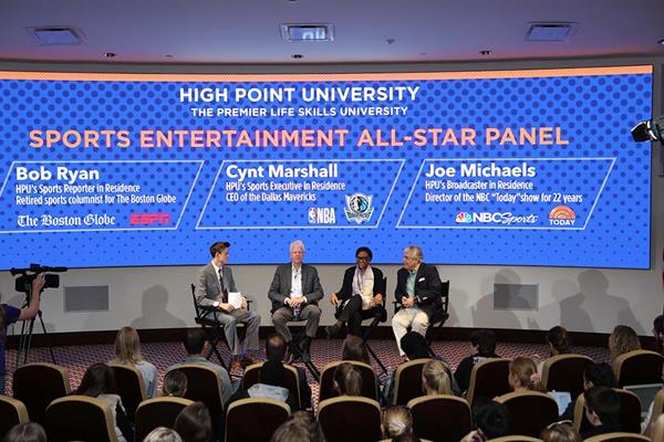 High Point University senior Logan Carter (far left) leads the All-Star Panel featuring Bob Ryan (left of center), retired sports columnist for The Boston Globe and HPU’s Sports Reporter in Residence; Cynt Marshall (right of center), CEO of Mark Cuban’s NBA team the Dallas Mavericks and HPU’s Sports Executive in Residence; and Joe Michaels (right), associate professor in the Nido R. Qubein School of Communication, former director of the NBC’s “TODAY” show and HPU’s Broadcaster in Residence. 