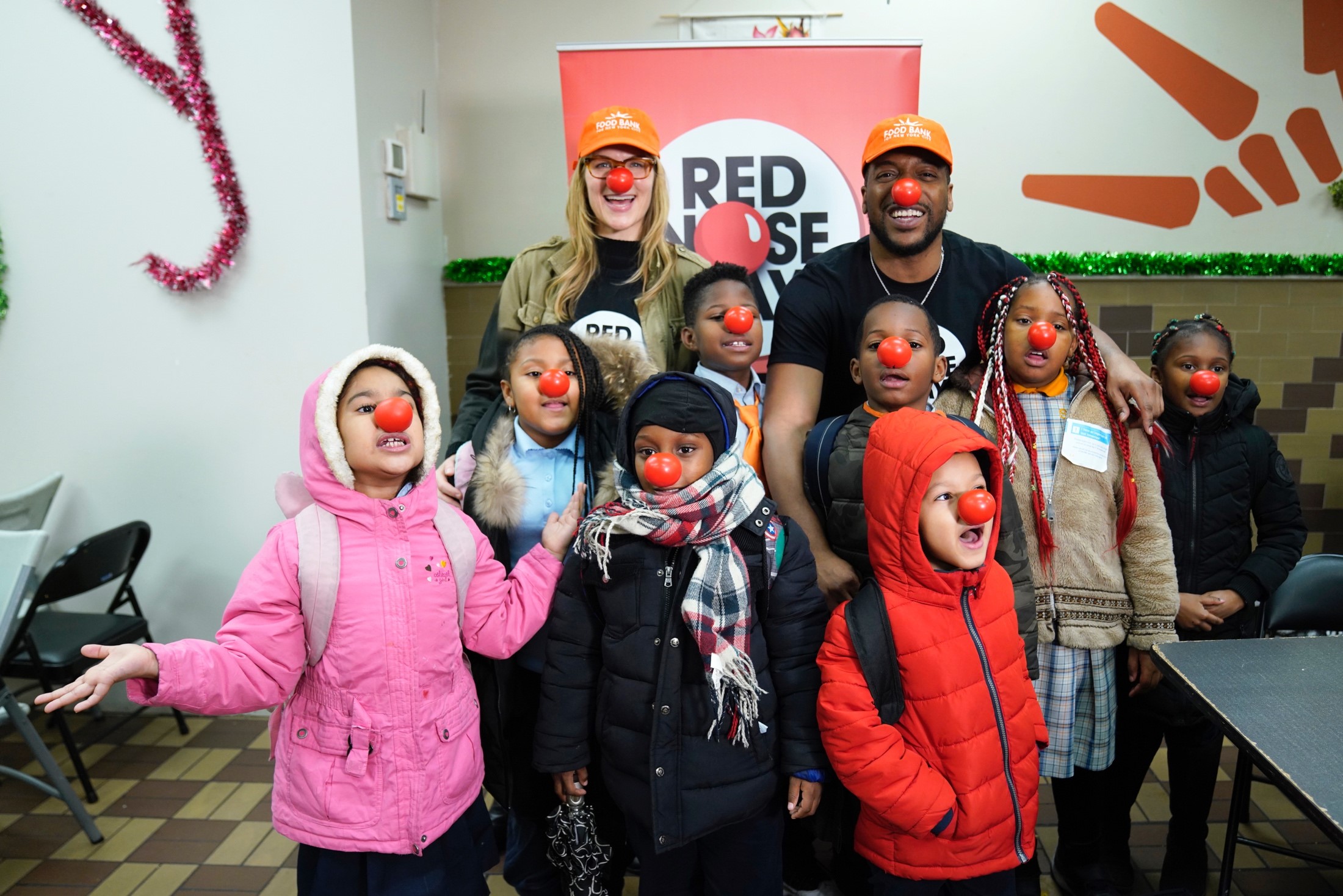 Alison Moore, CEO, Comic Relief USA, and New Amsterdam’s Jocko Sims at Food Bank for New York City celebrate raising $200 million to help end child poverty, supporting programs at grantee partners like Feeding America. 

(Left-Right) Alison Moore, CEO, Comic Relief USA; Jocko Sims, New Amsterdam with children at the Food Bank for New York City. 

Photo Credit: Ralph Bavaro/NBC