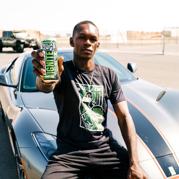 UFC fighter Israel Adesanya holding a can of Kill Cliff Ignite