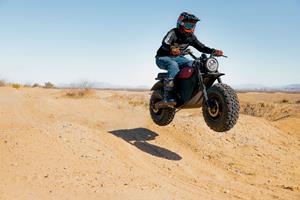 Rider jumping sand dunes on new VLCN Grunt EVO Electric Motorcycle