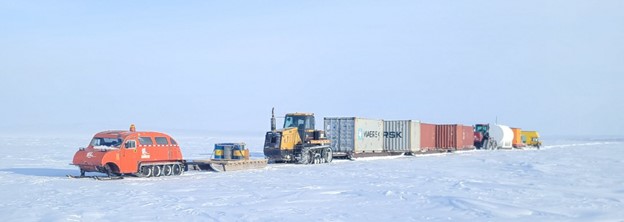 A snow train transporting fuel and drill materials to Ferguson Lake Project