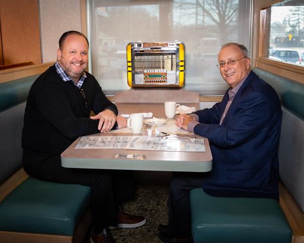 Dan Pickett, CEO of aptihealth, has coffee with Dr. John Bennett, president and CEO of CDPHP, at Halfmoon Diner in Clifton Park, NY while talking about meeting the mental health care needs of the community. 
