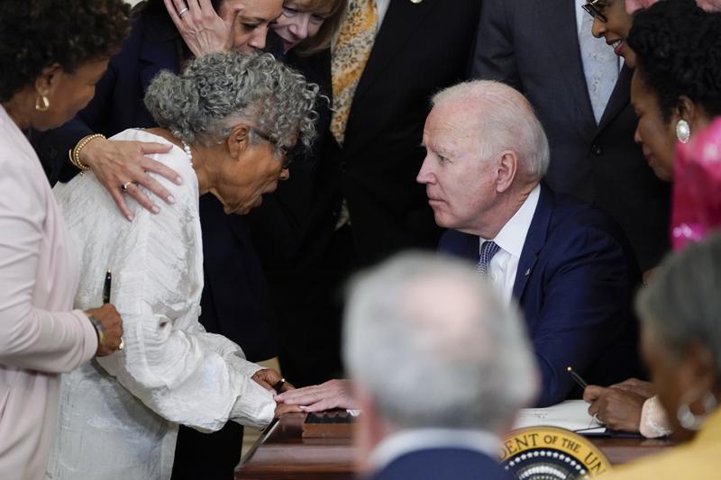 Ms. Opal Lee at The White House embraced by President Joe Biden and Vice President Kamala Harris [Credit: Associated Press]