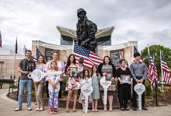 The family of Army Sergeant 1st Class Keith Callahan, Army Staff Sergeant Jacob Hess,  Army Chief Warrant Officer 3 Christopher Allgaier, and Army Staff Sergeant Kyu Chay receive mortgage-payoff notices from the Tunnel to Towers Foundation.  