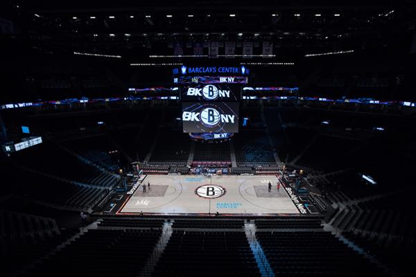 Barclay Center, home of the Brooklyn Nets, basketball floor finished with Bona. 