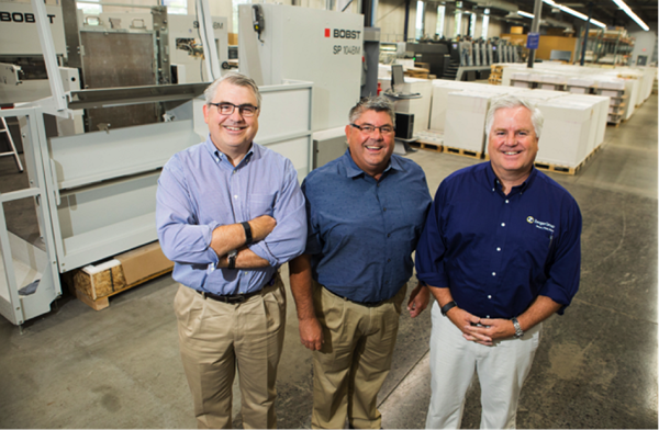 Three of the five Zenger brothers who work at Zenger Group today after having learned the principles of graphic arts from their father George “Bear” Zenger. (L-R) – Steve Zenger, CEO; John Zenger, Vice President; Joe Zenger, CFO