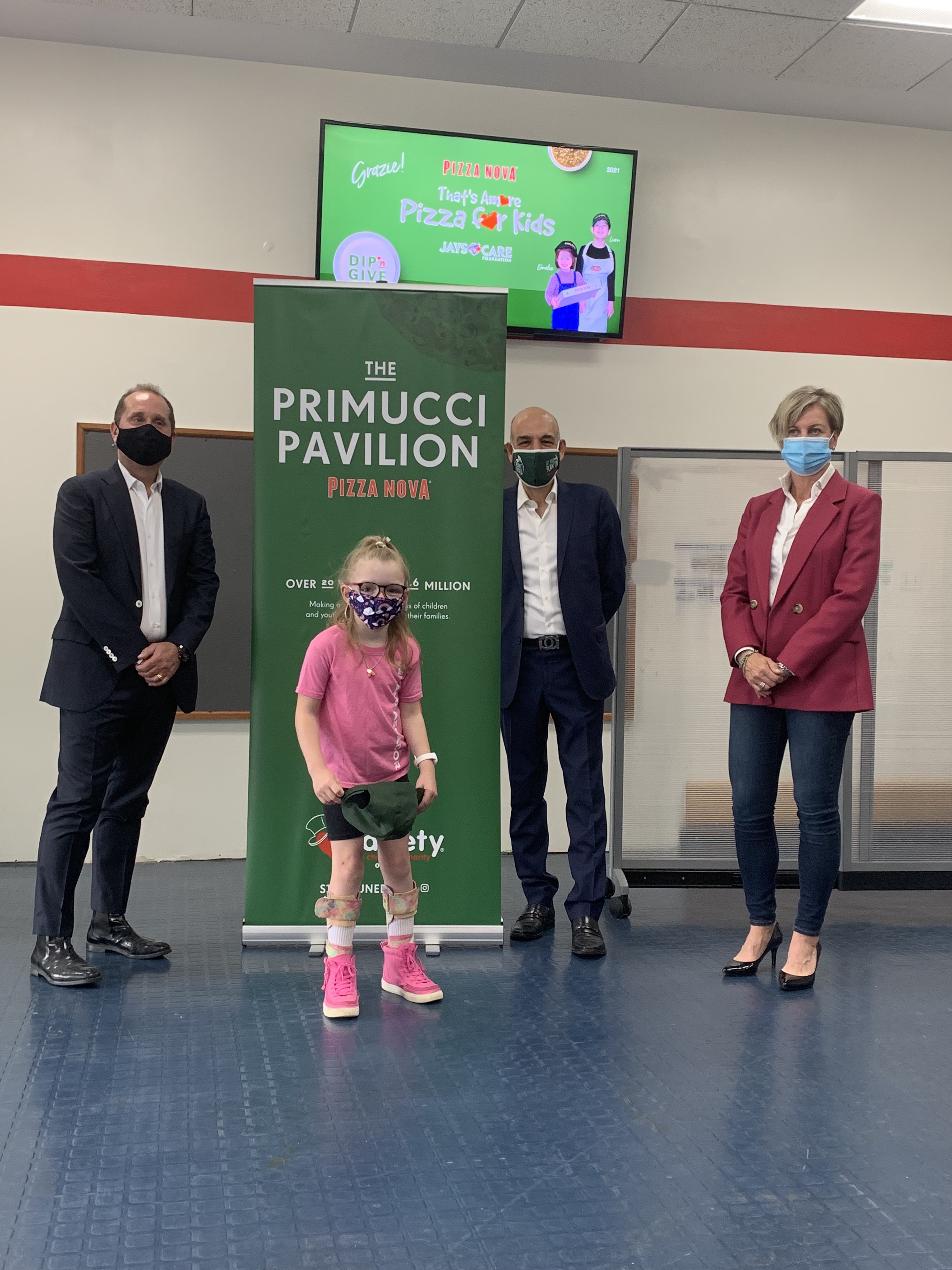 Variety Village lobby is renamed “The Primucci Pavilion” to honour Pizza Nova Founding Family. Charles Taerk, Board Chair Variety (left), Madi Ambos, Variety Ontario Brand Ambassador (middle), Domenic Primucci, Pizza Nova President (back right), Variety – the Children’s Charity of Ontario CEO, Karen Stintz (front right)