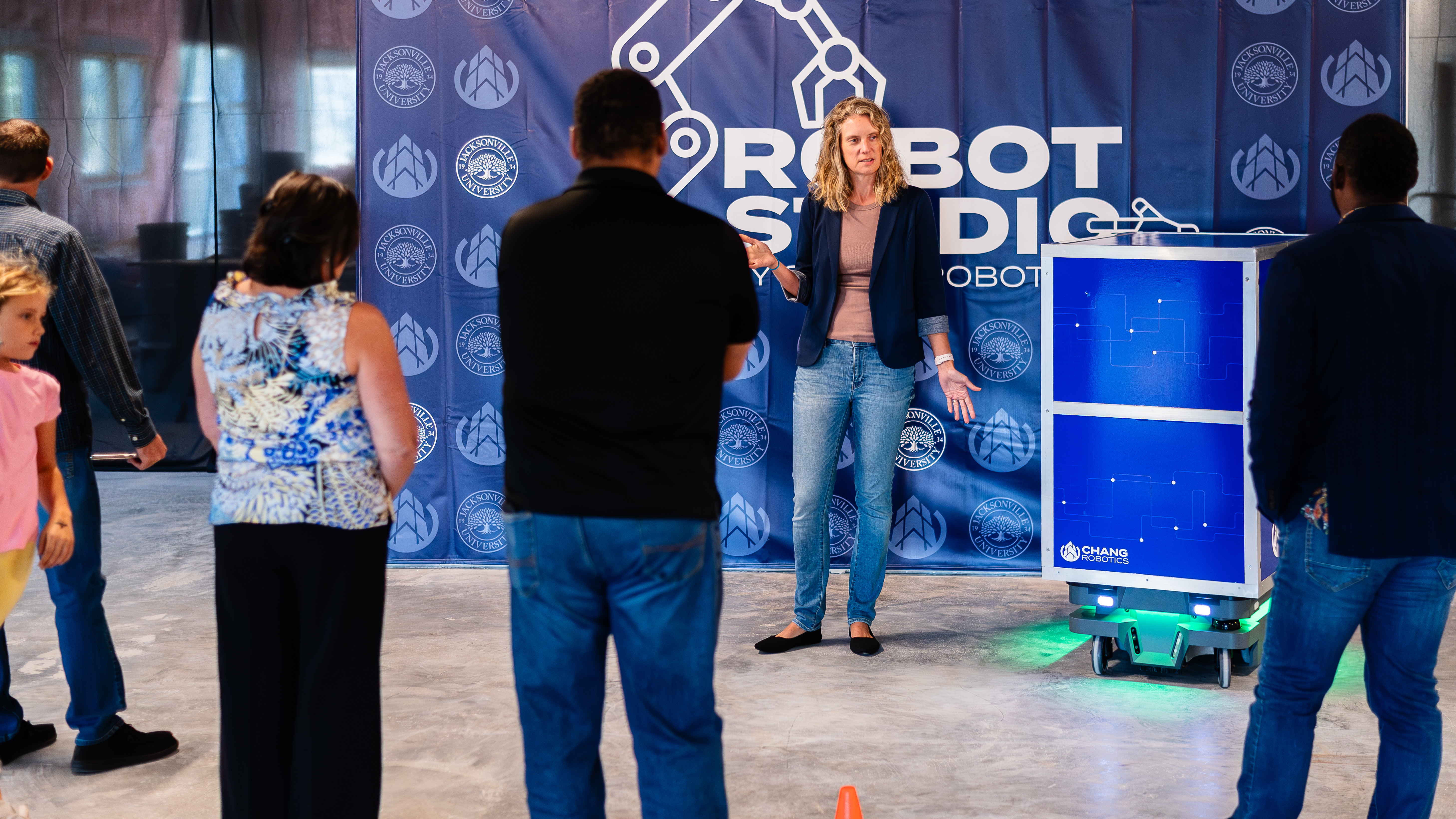 Kate McAfoose (Chang Robotics President) giving a tour at the Robot Studio.