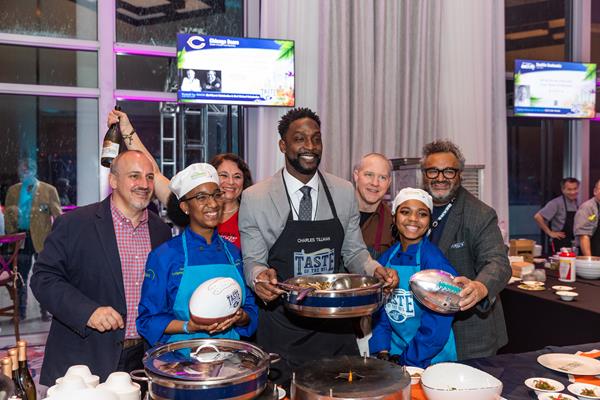 Florida ProStart students pose with former Chicago Bears Cornerback Charles “Peanut” Tillman to showcase the dishes prepared at their table. Students worked with Chef Carie Nahabedian, a James Beard Award-winning chef known for her Chicago-based Michelin star restaurant NAHA.