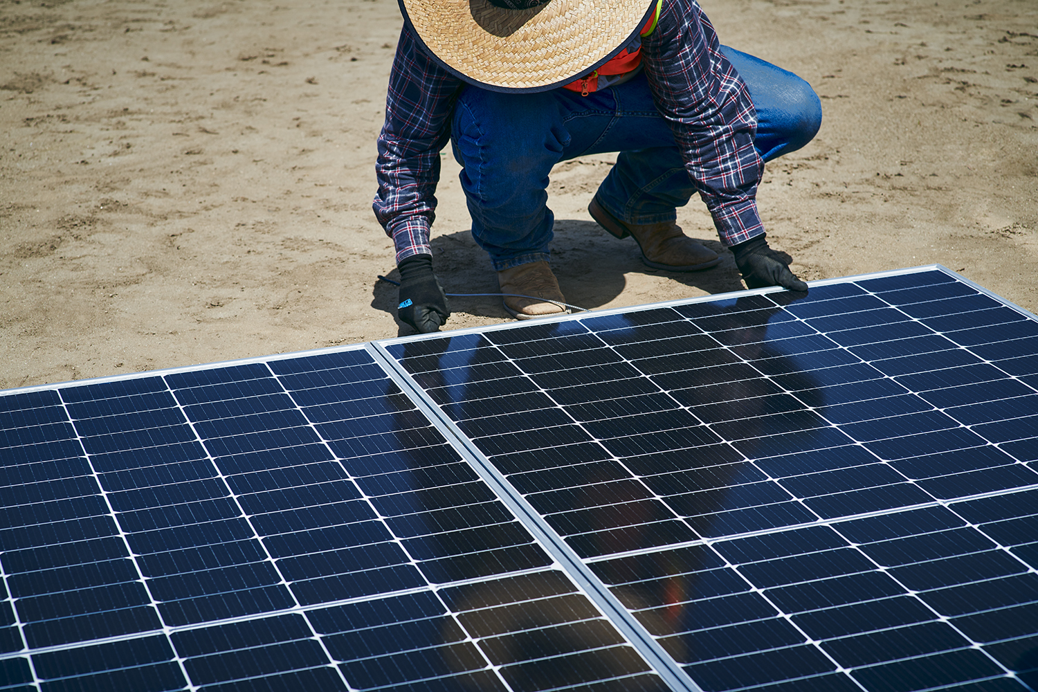 Site worker installing Earth Mount Solar