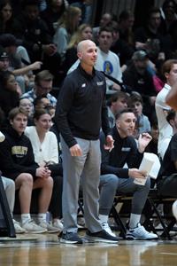 Phil Martelli, Jr. coaches from the sidelines during a recent Bryant men's basketball game. Photo by David Silverman