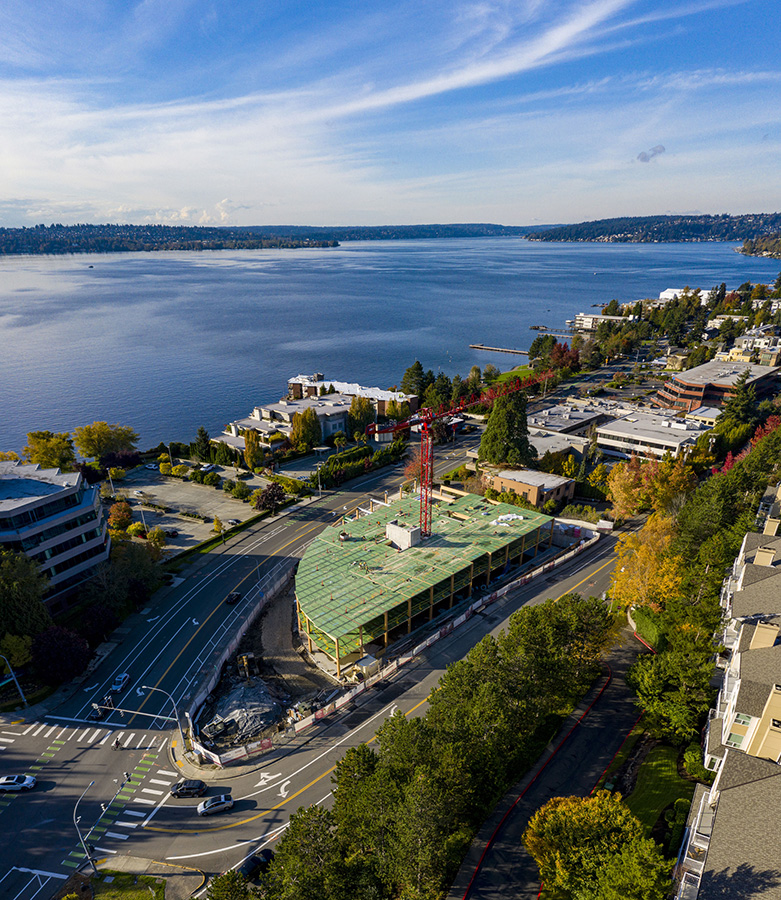 Aerial view of the new Lakeview Office Building currently under construction in Kirkland, Washington. The development includes a living roof, two levels of office space and two levels of underground parking, matching the civic scale of the neighborhood while minimizing impact on views of surrounding buildings. Image: © Adam Hunter/LMN Architects.