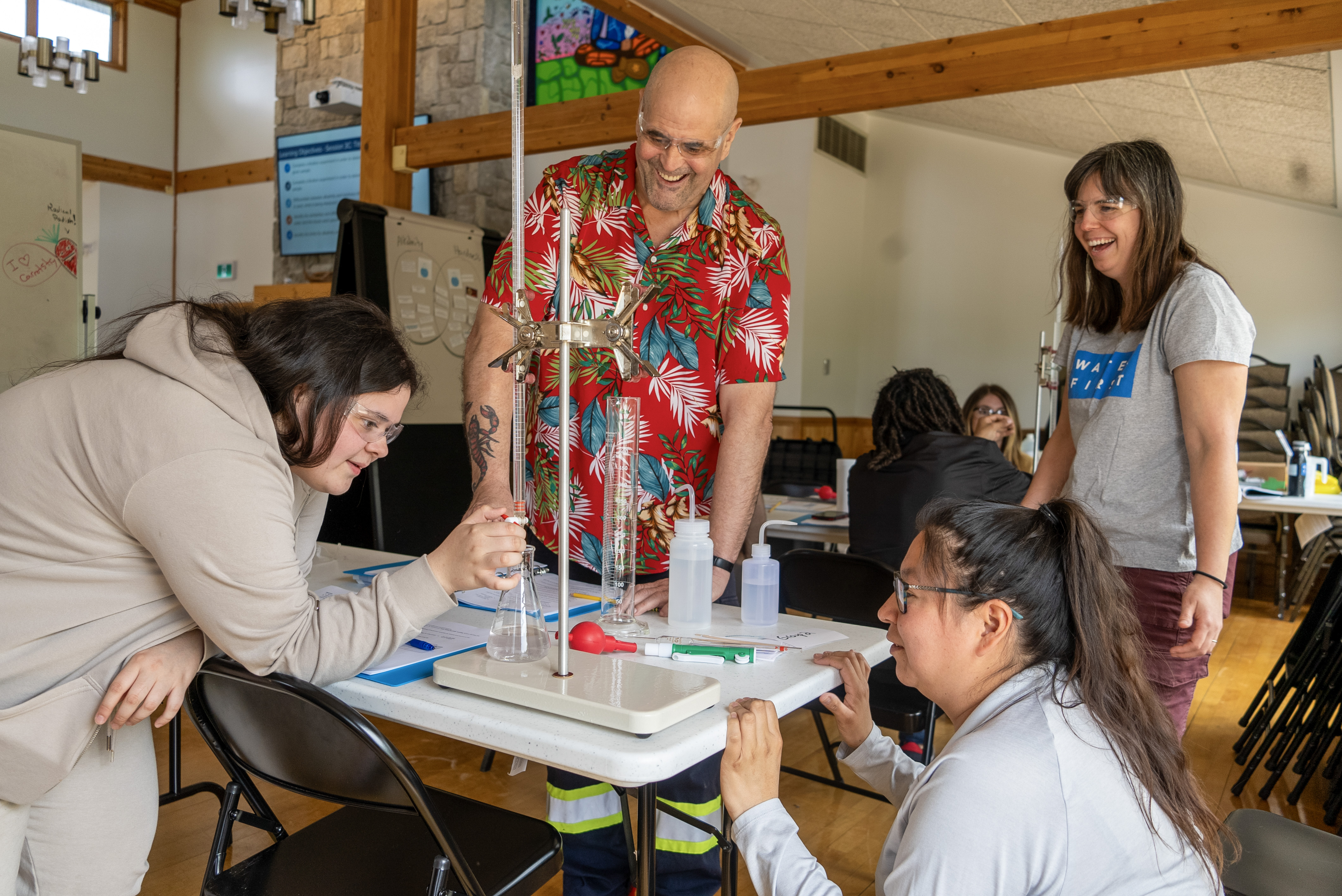 Water First interns use water science equipment during hands-on and experiential studying for Water Quality Analyst exam prep