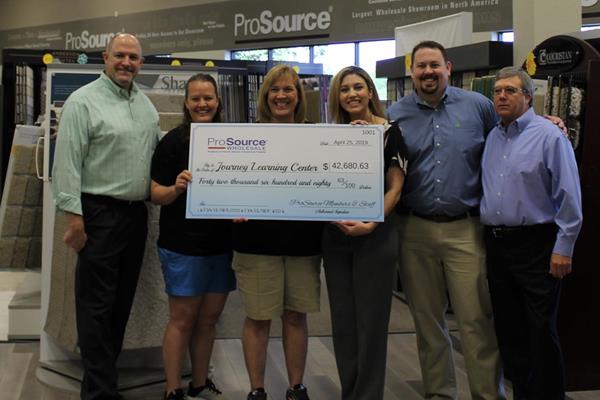 Journey Learning Center receives $42,680.63 check from ProSource Wholesale of TX Showrooms.