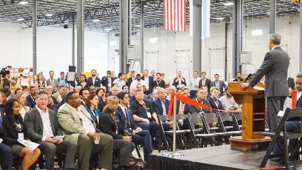 Attendees listen as Mark Skender (CEO, Skender), Gary Perinar (EST, CRCC) and gathered city officials address the crowd at a ribbon-cutting ceremony on May 28, 2019.